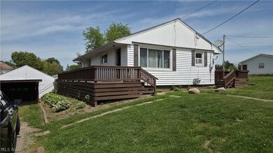 White single-story home with deck at 1135 Federal Ave, Zanesville