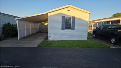 Mobile home with carport at 4830 Snowdrift Ln, Zanesville, Ohio