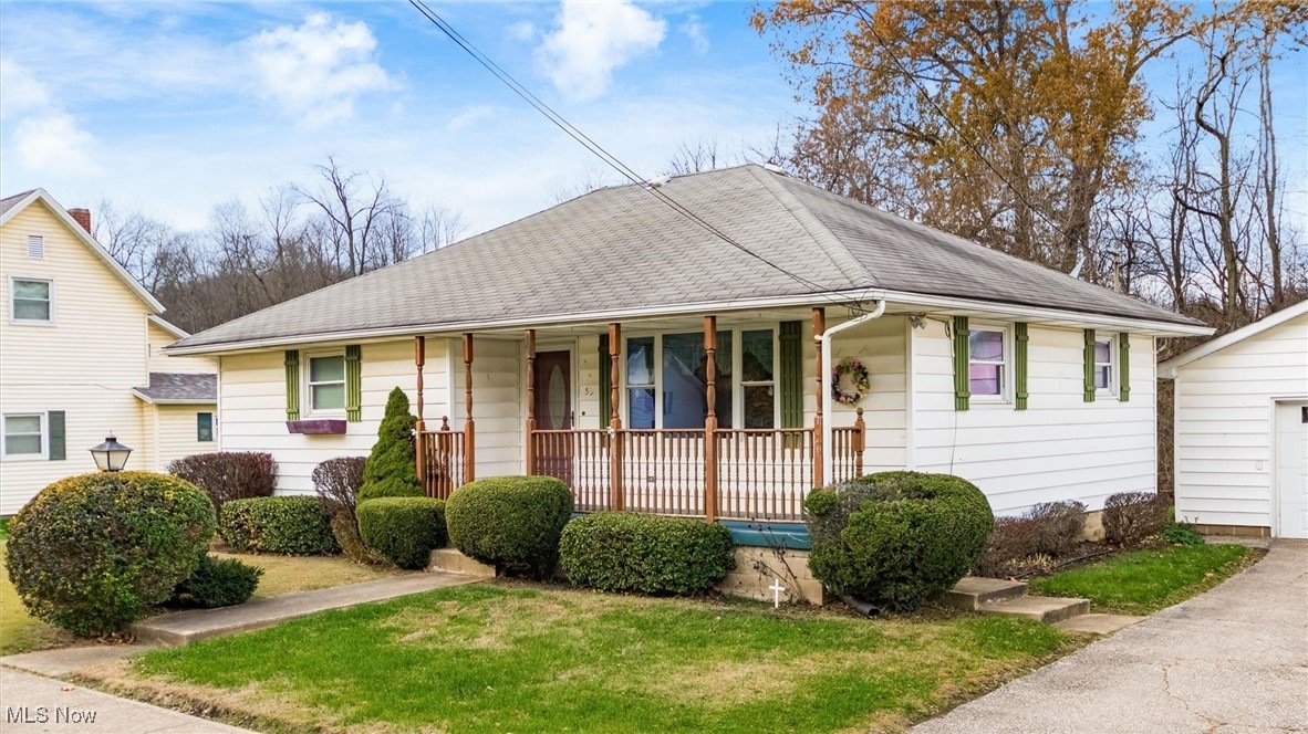 Ranch home with covered porch at 53 W Dave Longaberger Ave, Dresden